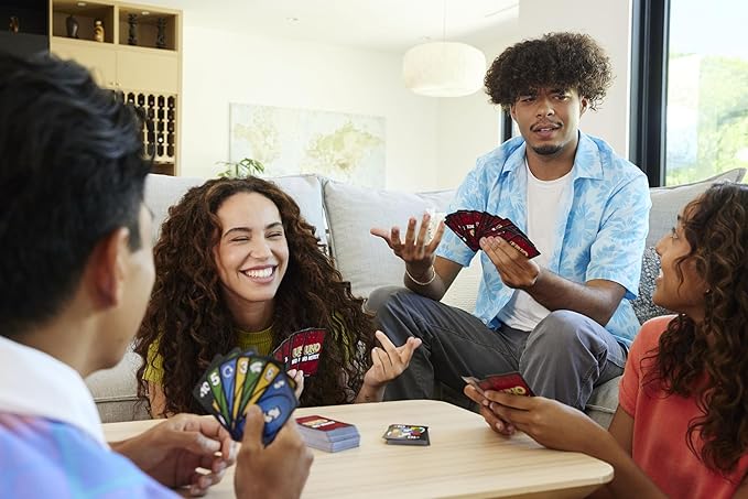 Mattel Games UNO Show ‘em No Mercy Card Game for Kids, Adults & Family Parties and Travel with Extra Cards, Special Rules and Tougher Penalties.